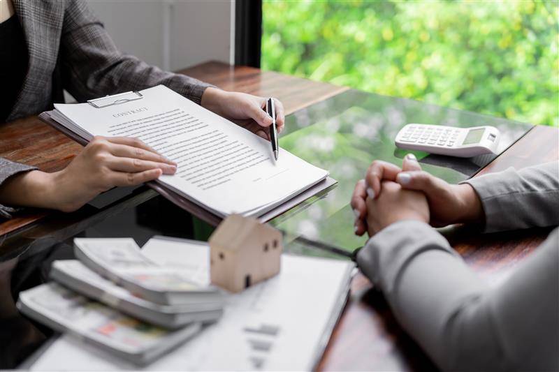 Landlord signing property insurance agreement 